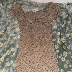 Brown and tan floral print dress with ruffles and tie front detail